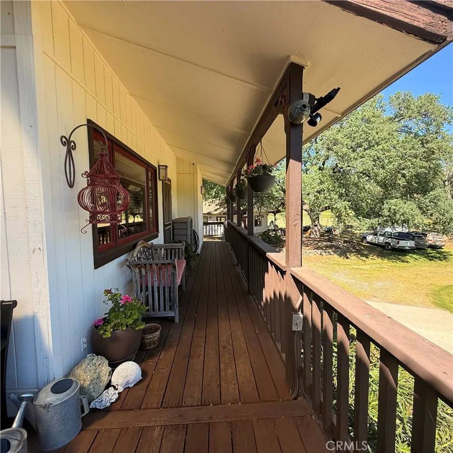 Long deck off the front of the house to the main bedroom #3.