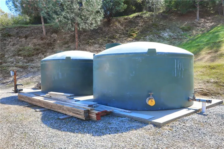 2 2500 gallon water storage with fire hose hook ups at shop