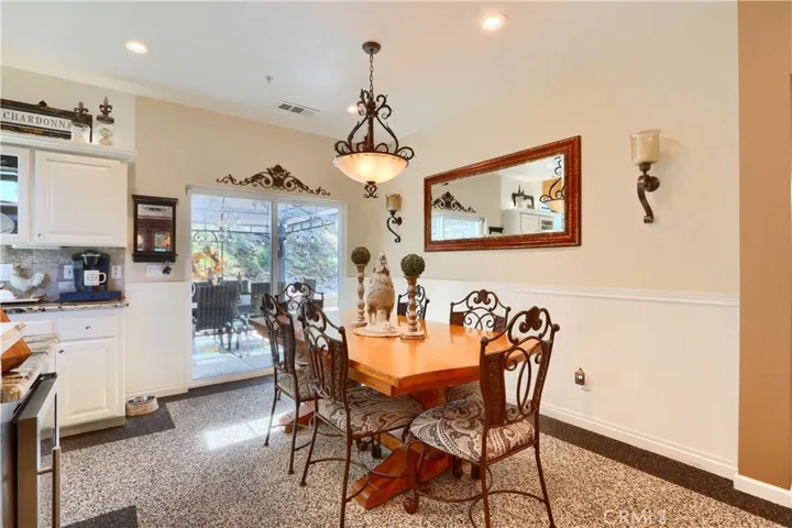 kitchen dining leads out to back patio pebbletec flooring
