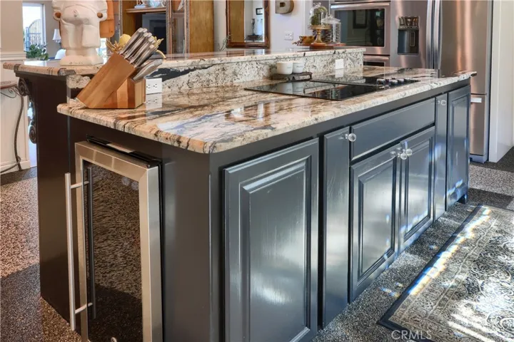 built in wine refrigerator in kitchen island with breakfast bar