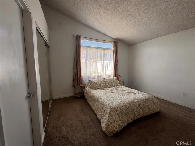Main bedroom with two closets and private bathroom.