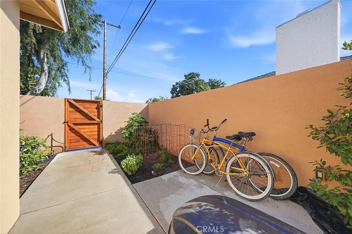 Gated side yard is perfect for bikes and surfboards