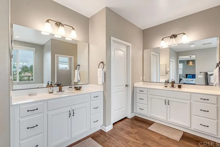 En Suite Up - Two Door entry to Walk in Closets that surround the en suite