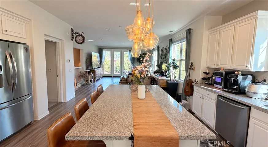 Kitchen with chandelier and dining space, original owner townhome The Heights on Beverly Whittier
