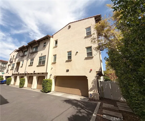 Attached garage and driveway, tri-level end unit townhome The Heights on Beverly Whittier 90601

