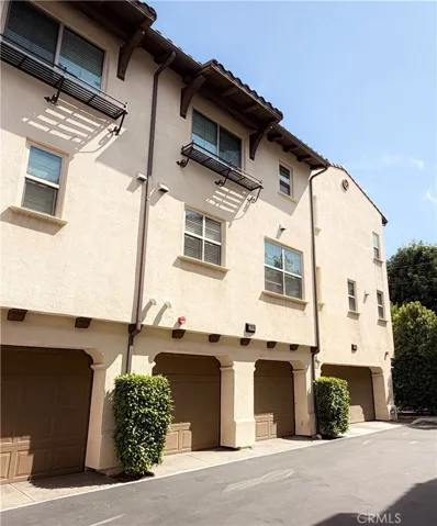 End unit exterior highlighting three-sided exposure, attached garage, 11908 Nixon Lane Whittier CA
