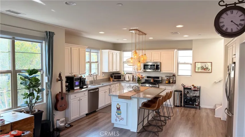 Kitchen with statement island and multi-light pendant fixtures, 11908 Nixon Lane Whittier CA 90601
