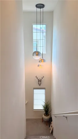 Interior hallway with designer barn door detail, tri-level end unit townhome Whittier CA
