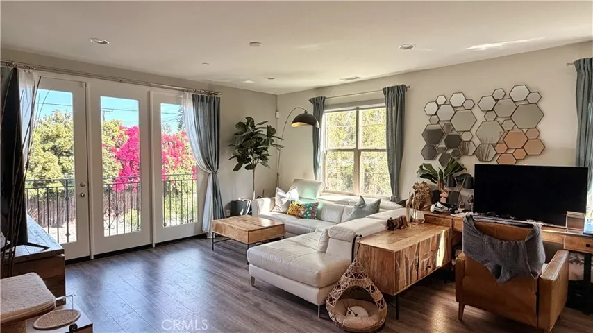 Bright living room with multiple windows, end unit natural light advantage, Whittier CA townhome
