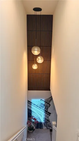 Entry stairway with custom wooden slat accent wall, 11908 Nixon Lane The Heights on Beverly
