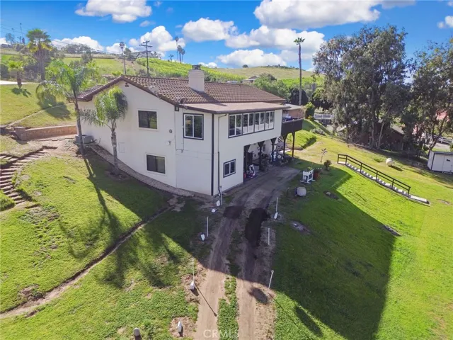 Two levels currently operating as independent living spaces; separate exterior access to downstairs