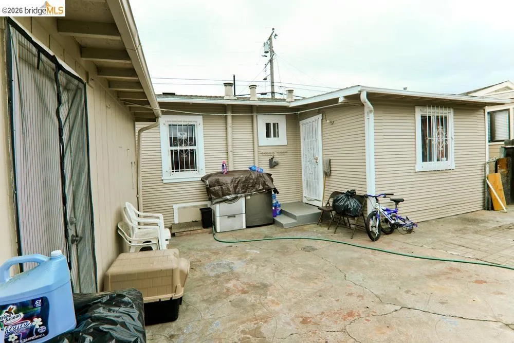 Rear view of property with a patio area