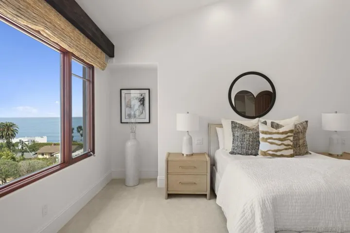 Second guest bedroom with beautiful ocean views, where natural light and coastal scenery create a serene and inviting space for guests.