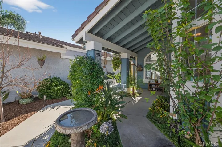 Porch swing, flowers, succulents and fruit trees.