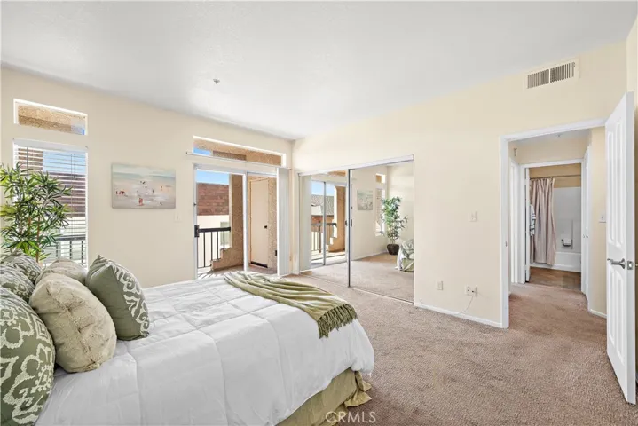 Primary bedroom has mirrored closet doors