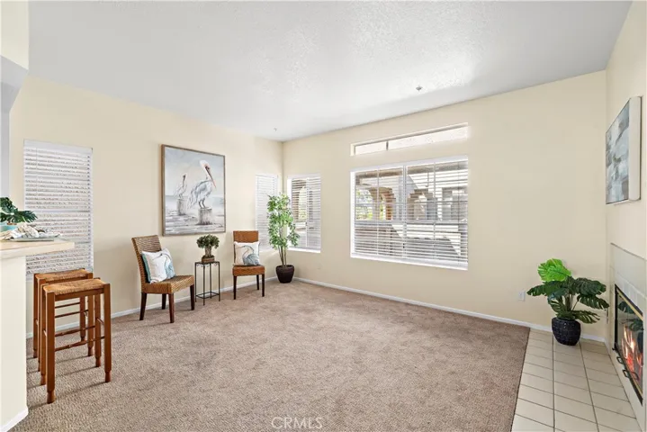 Livingroom with carpet. Lots of natural light