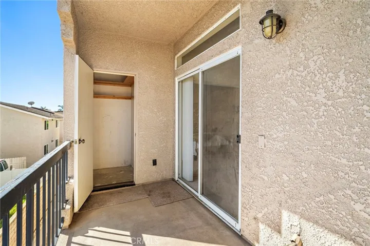 Balcony off of primary bedroom has a storage closet