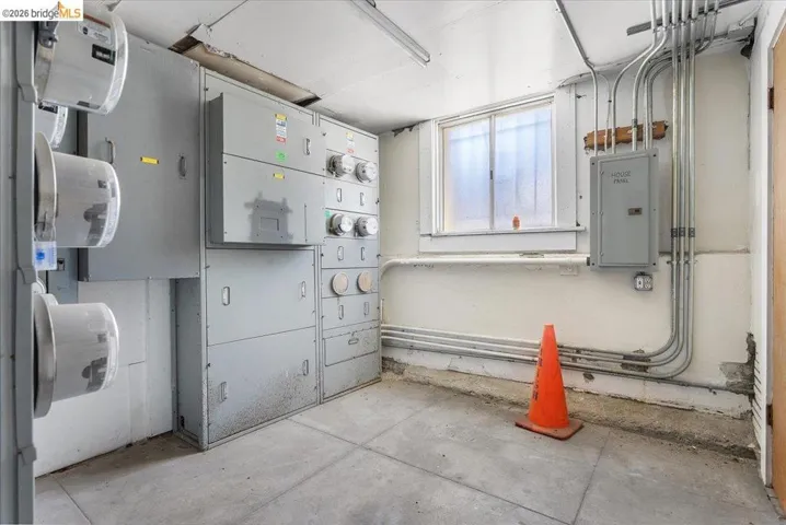 Utility room with electric panel and electric meter