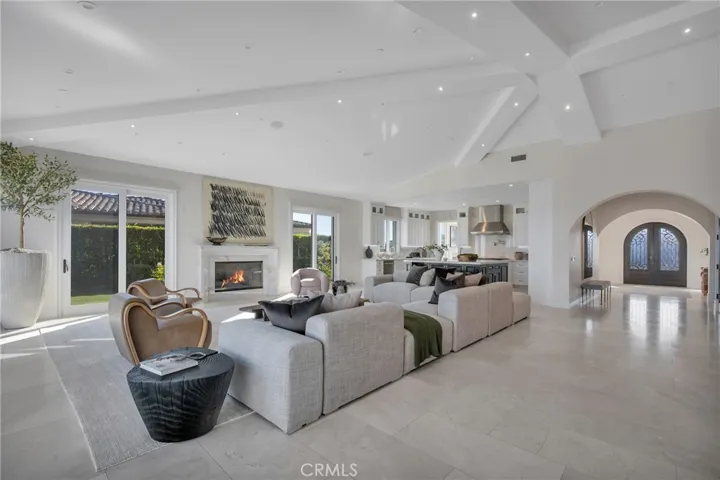 Great Room with Fireplace, Vaulted Ceilings and Access To Lage Ocean View Patio