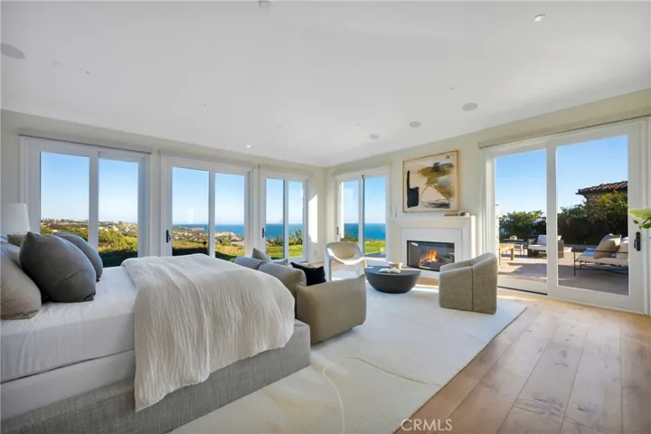 Primary Suite with Stunning Ocean Views, Fireplace, Multiple Sliding Doors and Custom Automated Shades