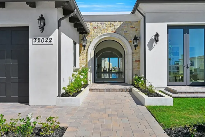 View Through The Home To Back Patio From Open Front Doors