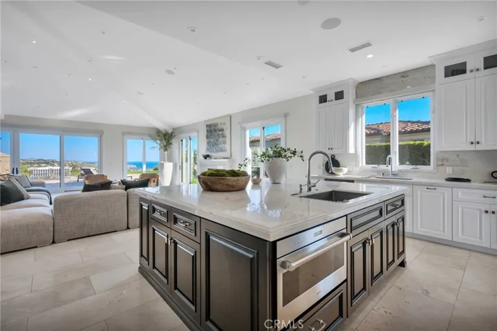 Chef's Kitchen with Huge Marble Center Island, 2 Sink Stations, Wolf Range Subzero Refrigerator