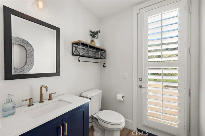 Downstairs Powder room with back yard access