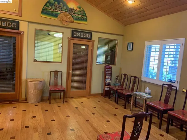 Sitting room with a vaulted wood ceiling