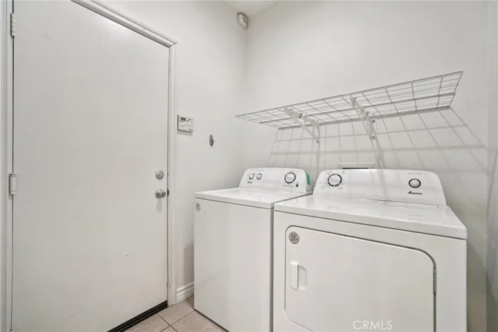 Inside laundry room, washer and dryer included