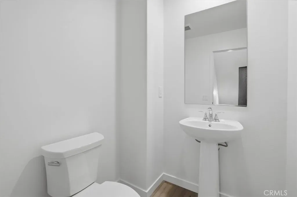 2nd Level Powder Room PHOTOS ARE OF MODEL MATCH AND HAVE BEEN VIRTUALLY STAGED. INTERIOR AND EXTERIOR FINISHES MAY VARY