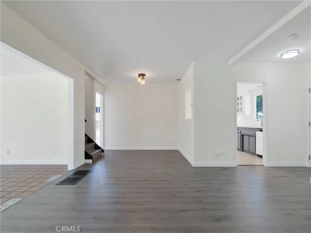 Living Room View To Dining Area, Enclosed Patio & Kitchen