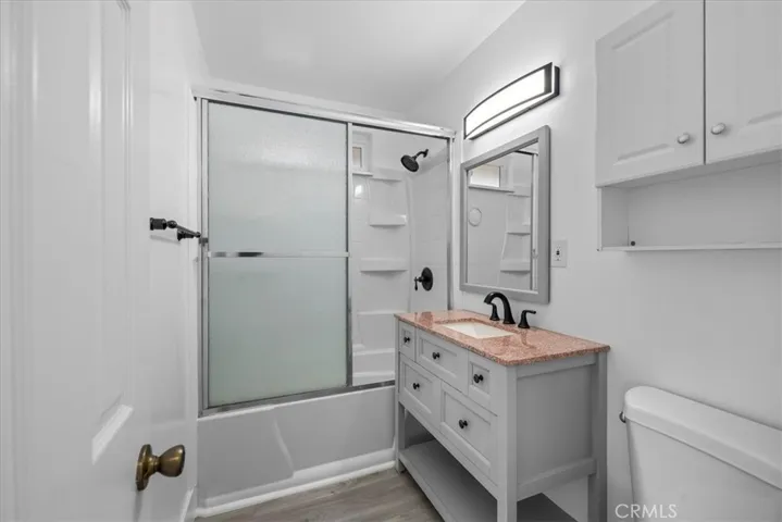 Remodeled bath; tub enclosure has built in pocket shelves