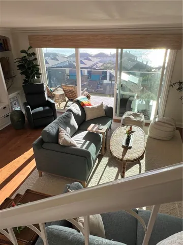 LIVING ROOM OPENS OUT TO THE BALCONY
