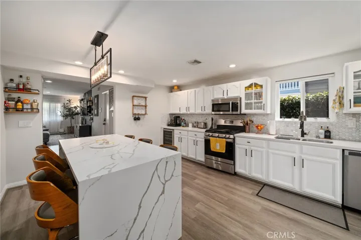 All stainless steel appliances. Open concept kitchen to living area.