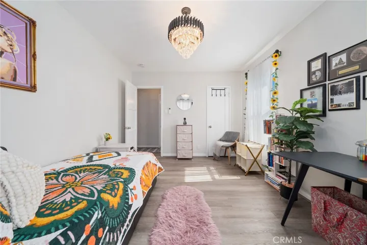 This bedroom walks through primary. Shares exit to downstairs.