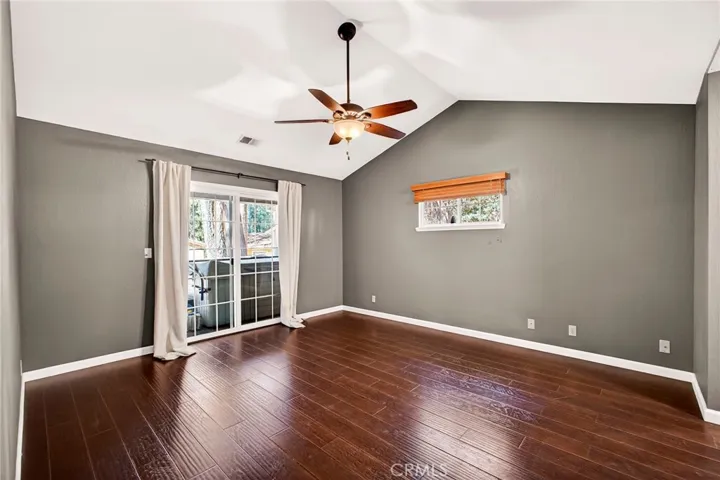 primary bedroom with slider to hot tub & deck