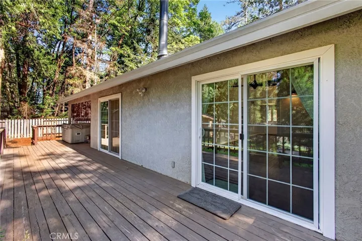 large deck with 3 sliders to house