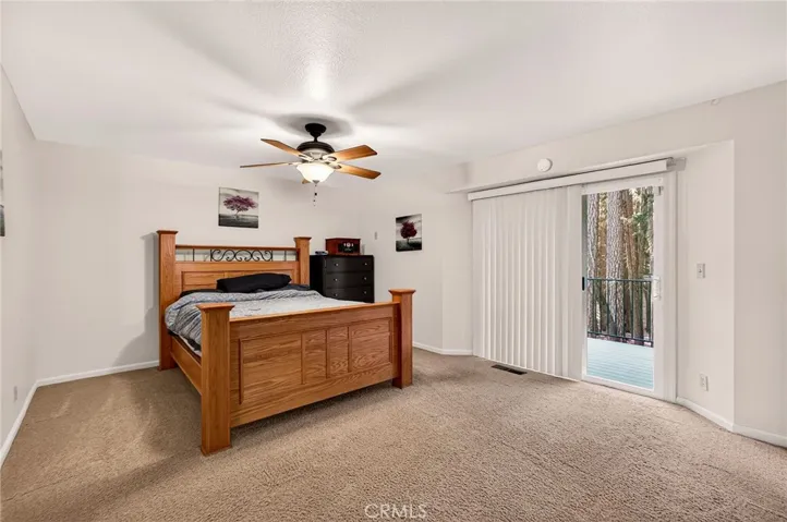 Primary bedroom with slider to back deck