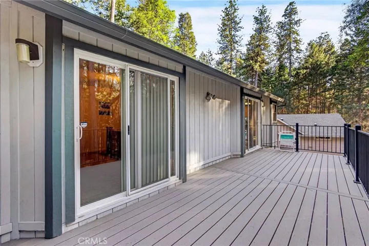 sliding glass doors from main living area & primary bedroom