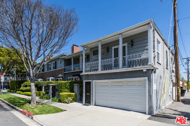 2 Garage Spaces, off alley.