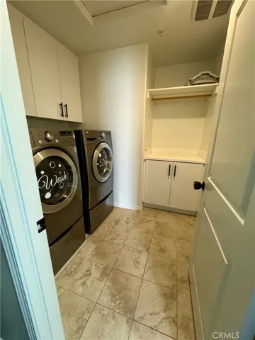 The spacious laundry room comes with included LG washer & dryer and substantial space for extra storage of blankets and linens.