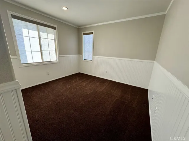 Bedroom Number 2 features wainscoting and has great natural light.