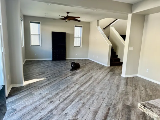 Here is a view of the dining room and living room open floorplan concept.  Please note, the beautiful chocolate lab is not included and she was trained since she was a puppy to never go upstairs and only do her business in designated gated area.