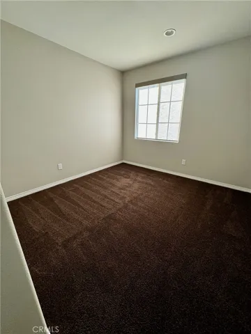 Bedroom number 1 is roomy and has large closet and window facing the beautiful community.