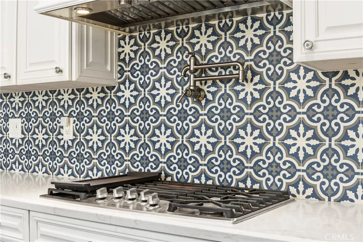 Custom tile backsplash with pot filler