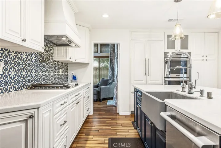 Custom cabinets, vent hood and built in fridge