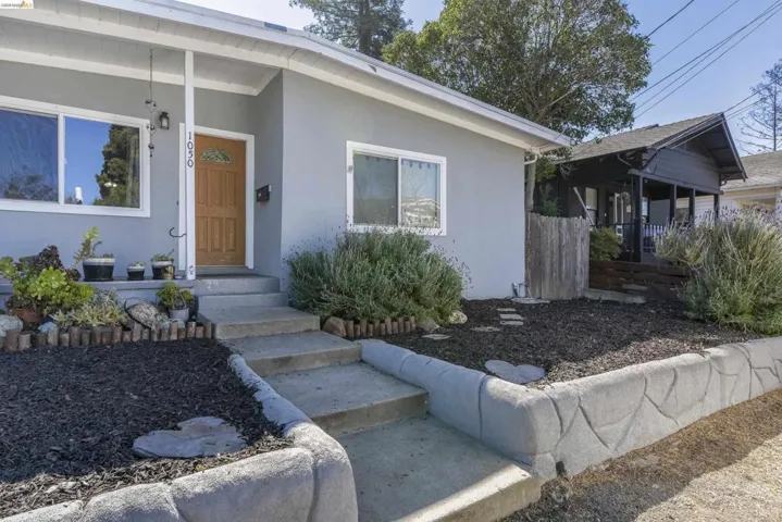 Entrance to property featuring stucco siding