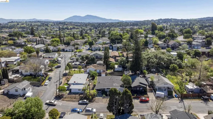 Aerial perspective of suburban area featuring a mountain backdrop