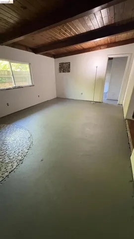 Exposed wood beam ceiling with natural finish
