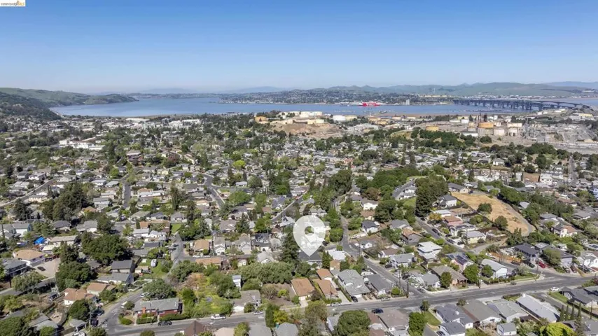 Aerial view of residential area featuring a water and mountain view